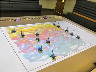 Interactive Multi-Robot Painting Through Colored Motion Trails